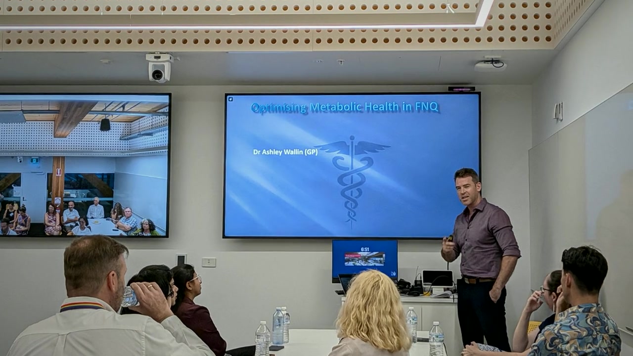 Dr Ash Wallin presenting metabolic health education to a group